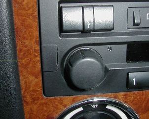 Here's the small door you need to flip open on the side of the standard radio