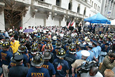 FDNY members gather at the NYSE to watch the presentation of a steel girder from the WTC to the USMC.