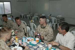 Geraldo Rivera (far right), senior war correspondent, Fox News Channel, enjoys breakfast on June 25, at a dining facility aboard the air base in Al Asad, Iraq, with several Marines from 3rd Marine Aircraft Wing. During his two-day visit, the 61-year-old New York City native spent time with servicemembers and civilians, which included posing for hundreds of pictures and signing autographs.  Photo by: Staff Sgt. Houston F. White Jr.